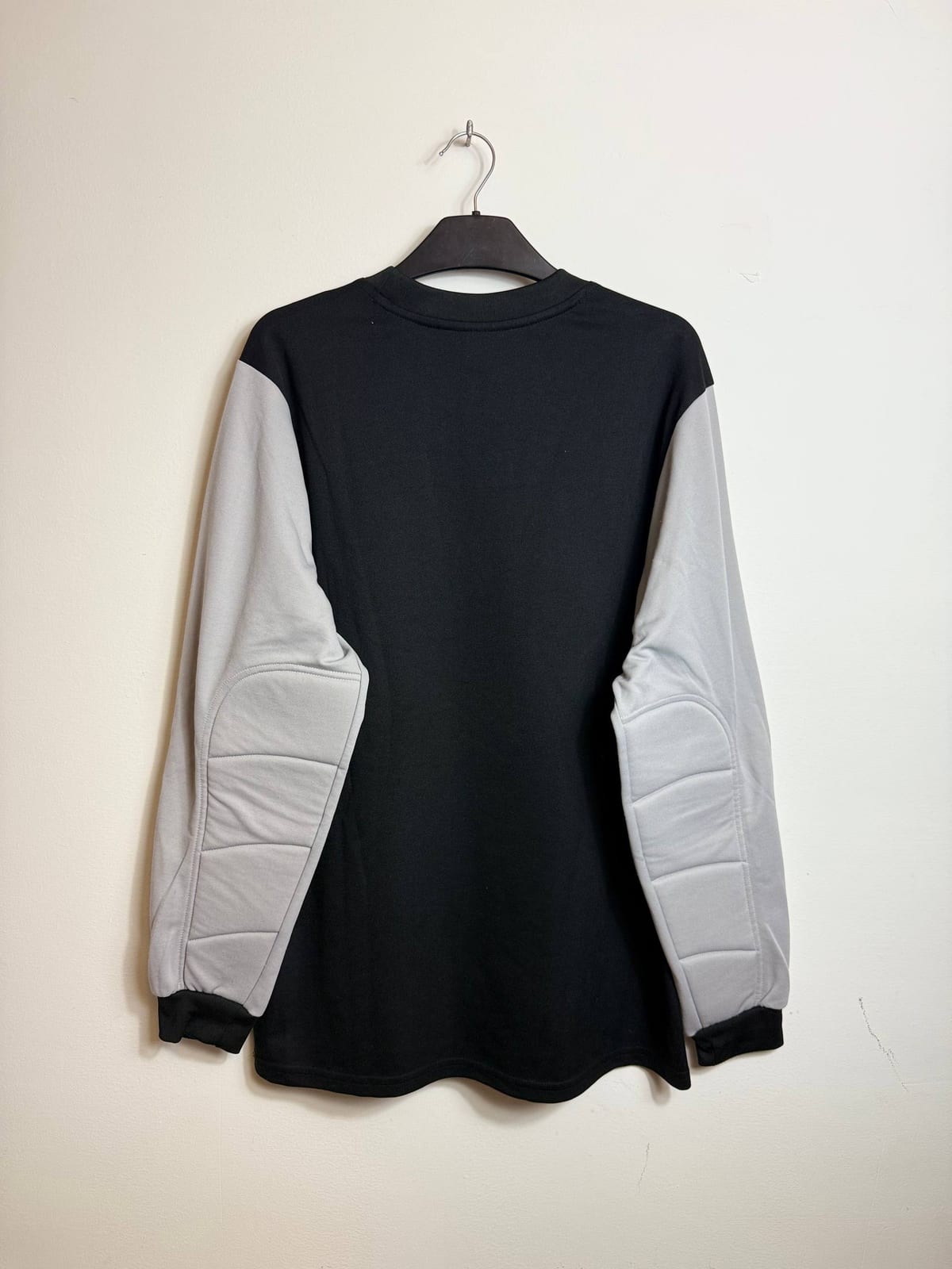Puma long sleeve top with padded elbows.